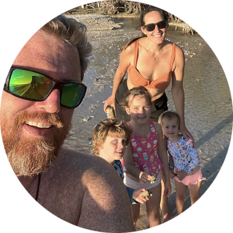 John Lee with his wife and three kids at the beach